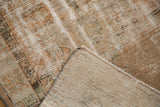 Distressed vintage Oushak rug pile texture with visible foundation and light hand-knotted reverse.