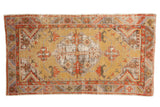 Vintage distressed Oushak runner, golden field, geometric medallion, red and blue accents, 2'7