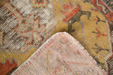 Distressed vintage Oushak rug pile and hand knotted reverse weave in gold, rust, muted tones.