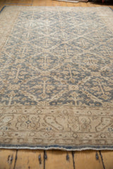 Hand-knotted vintage Oushak rug border with antique ivory traditional motifs and worn denim blue pile.