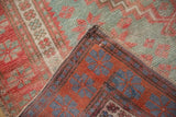 Hand knotted Turkish Oushak rug: corner folded, showing distressed pile and tight reverse.