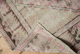 Vintage Oushak rug's heavily worn pile with exposed foundation.