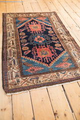 Vintage Hamadan rug detail showcasing navy field, terracotta, and sky blue Mahi Mahi design.