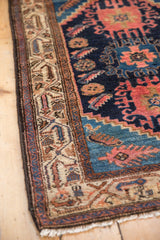 Vintage Hamadan rug corner detail, with traditional ivory border and navy blue field patterns.