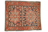 Antique Heriz rug, double medallion, sprawling vinery in dusty navy, wine red, powder blue.
