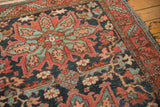Serrated leaf border and geometric field motifs in dusty navy, wine red, and mallard green.