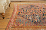Vintage Malayer rug detail: stepped diamond, Herati motif, and wear exposing foundation.