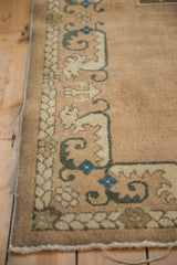 Vintage Chinese rug corner, featuring intact original selvage and curvilinear blue border.