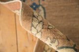 Intact original side selvages and time-softened pile of a vintage Chinese rug.