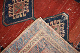 Revealing the hand-knotted construction on the folded corner of an antique Bakshaish rug.
