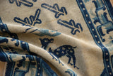 Pictorial cobalt blue deer motif on the vintage Chinese Peking rug's textured pile.