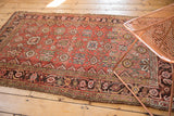 Worn brick red Mina Khani field and dark patterned border of antique Kurdish Bijar rug.