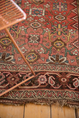 Lower border detail of antique Kurdish Bijar rug, showcasing unique floral patterns and rich, softened palette.