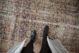 Distressed vintage Malayer runner with low pile, displaying faded denim blue and rose Herati motifs.