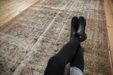 Vintage Distressed Malayer rug texture showing foundation wear and faded Herati pattern.