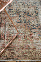 Worn pile of distressed Malayer rug, revealing foundation with denim blue Herati motifs.