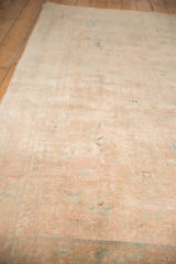 Vintage Kashan rug with faded beige and sand field, subtle aqua patterns, and even pile wear.