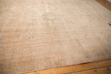 Soft beige and sand field with even wear on a vintage Kashan carpet.