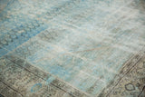 Detail of distressed Mahal carpet showing low pile texture, interior seam, and abrashes.