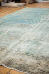 Distressed Mahal rug surface showing pale blue, beige, and visible knot head wear.