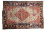 Antique Farahan Sarouk rug: central diamond medallion, delicate floral field, wide navy border, and rich abrashes.