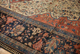 Antique Farahan Sarouk rug’s wide terra cotta main border, navy floral, and reciprocating pawn pattern.