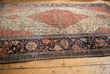 Antique Farahan Sarouk rug's unique wide border, pawn pattern, and worn floral motifs.