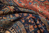 Intricate floral design and rich abrashes on an Antique Farahan Sarouk rug pile.