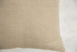 Textured natural beige jute and cotton pillow fabric with delicate subtle stripes.