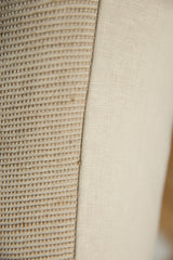 Textured jute fabric with subtle stripes and smooth linen backing of the pillow.