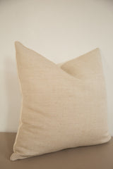 Natural jute and cotton pillow with delicate subtle stripes and linen backing.