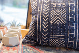Indigo Mudcloth Printed Throw Pillow bottom corner, textured jute and linen piping.