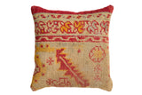 Antique Rug Fragment Throw Pillow with tribal red, gold, and sand geometric motifs, 18x18.