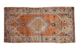Distressed Vintage Oushak rug runner, burnt orange field, central diamond medallion, grey-blue borders.