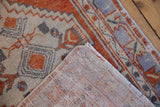 Vintage Distressed Turkish Oushak rug pile texture with madder red, ivory, pale blue, and visible woven foundation.