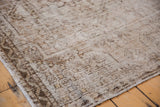 Close-up of distressed Vintage Oushak rug, worn pile reveals foundation, beige-copper palette.
