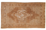 Distressed Oushak rug with oversized center medallion, bronze, beige, and silver tones, 3'10