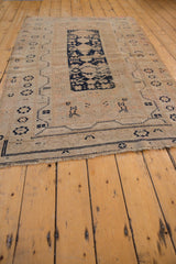 Visible, mostly even wear on the Oushak rug's knot heads and restored selvage.