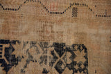 Vintage Oushak rug pile detail showing mostly even wear and visible foundation.