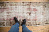 Vintage Distressed Oushak runner showing foundation, faded purple, ivory tones, and geometric border.