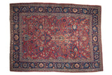 Vintage hand-knotted Persian Meshed rug, cochineal red field, floral tendrils, navy borders.