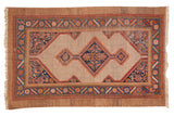 Vintage hand-knotted Camel Hair Serab rug with diamond medallion, geometric lattice in camel, navy, tangerine.