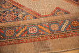 Vintage Serab rug: transition from camel geometric field to colorful patterned border.