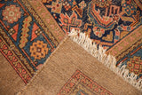 Vintage Camel Hair Serab rug corner with hand-knotted geometric pile, woven back, and fringe.