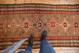 Repeating geometric starburst medallions on an unusual silver field of a Serab runner.