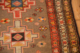 Vintage Serab runner's triple-banded meandering vine border and floral field details.