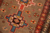 Geometric starburst medallion, red, blue florals on unusual silver field, triple vine border.