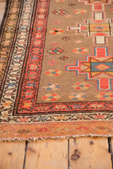 Vintage Serab rug runner fringe with faded tangerine and red vine borders.