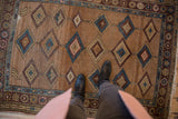 Antique Hamadan rug, natural camel field with repeating blue, aubergine, sand diamond pattern, even wear.