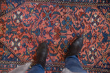 Vintage Malayer rug detail featuring Herati motif, raspberry red field, and navy blue.